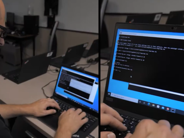 Male working on a computer, appears to be inputting commands for IT Security