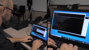 Male working on a computer, appears to be inputting commands for IT Security