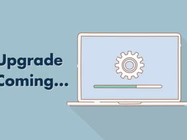 Graphic of laptop with gear on screen. Text that reads "Upgrade Coming"