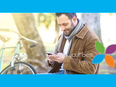 Man on bench in park with bike