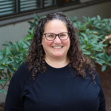 Woman wearing glasses smiles